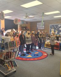 Ravenswood High School Chorus Members performing at the Library's 2021 Christmas Open House
