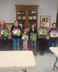 Image of participants at the Ravenswood's library December 2021 paint night