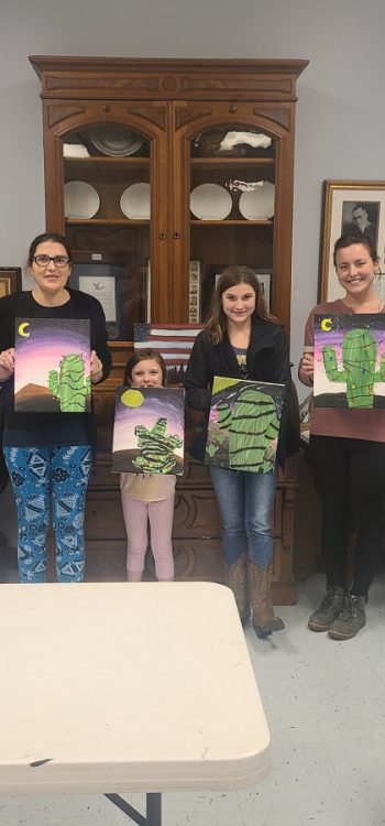 Image of participants at the Ravenswood's library December 2021 paint night